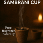 Burning natural Sambrani cup with aromatic smoke, shown with a soft candlelight background for pooja and meditation.