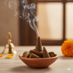 Handmade cow dung dhoop cones with natural herbs, resting on a copper plate, for pooja and air purification.